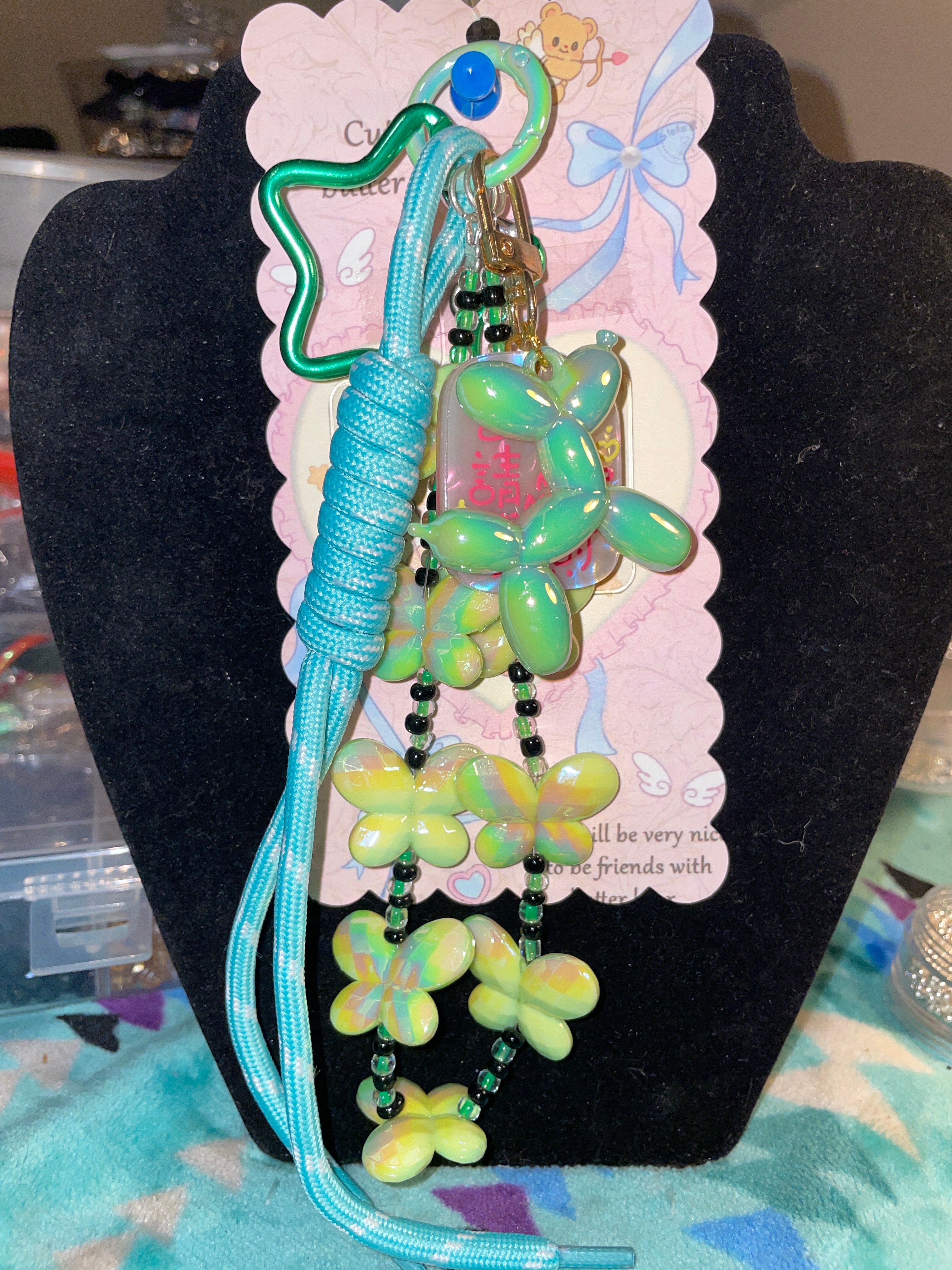 Lime, green butterfly with a balloon dog
