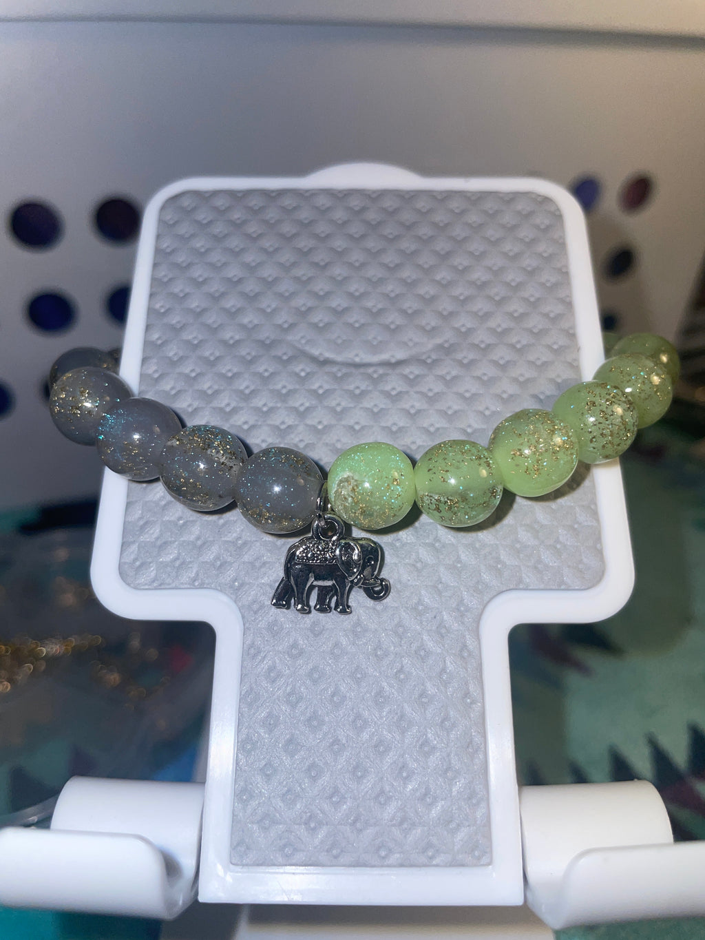 Lime green/gray bracelet with an elephant for a charm