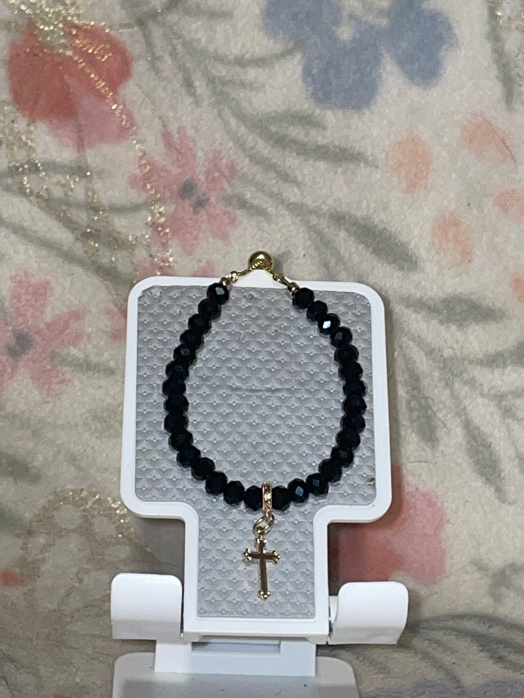 Black glass beads with gold plated cross