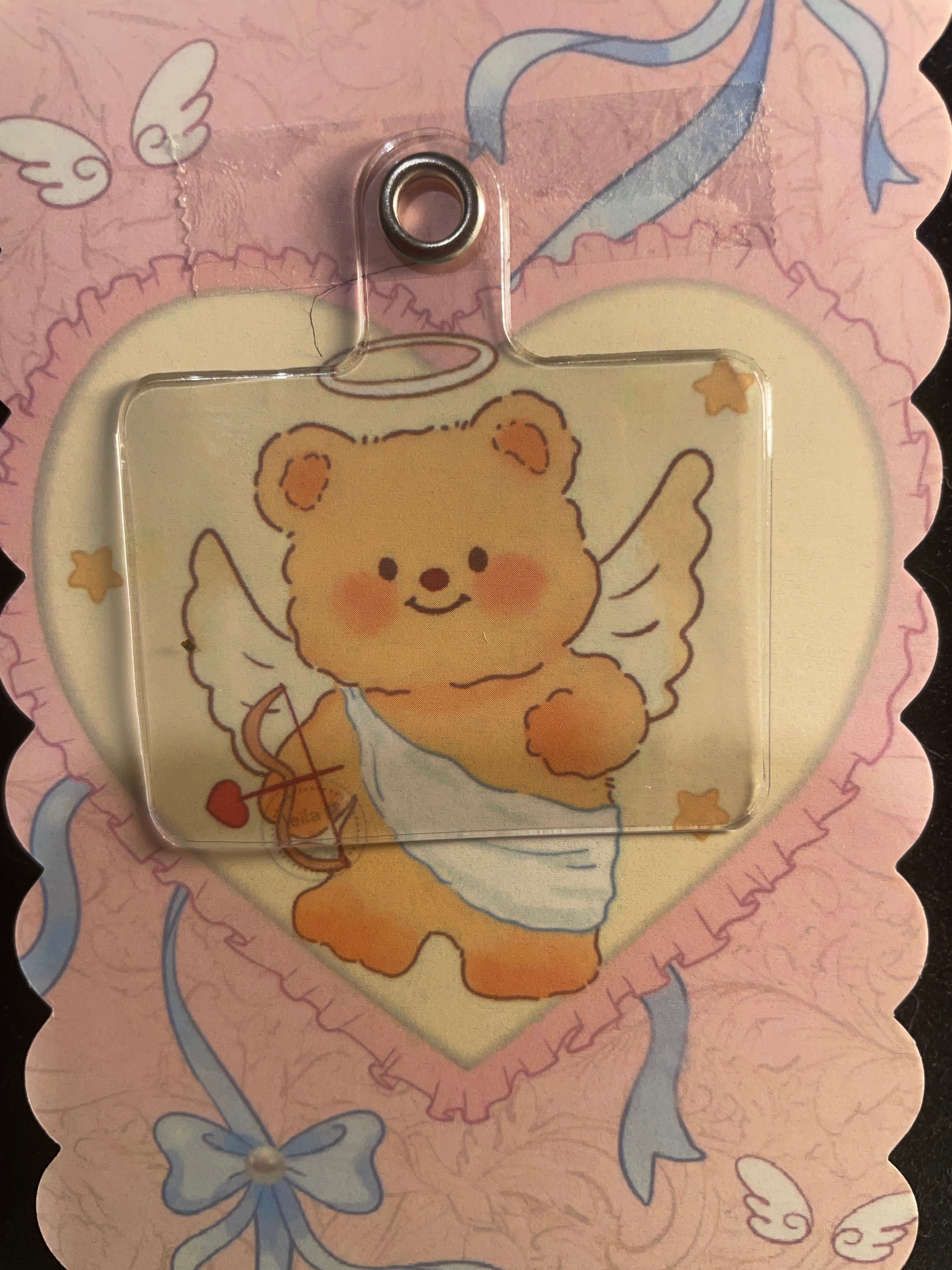 A beautiful luxury cat keychain that is designed with the red/silver design