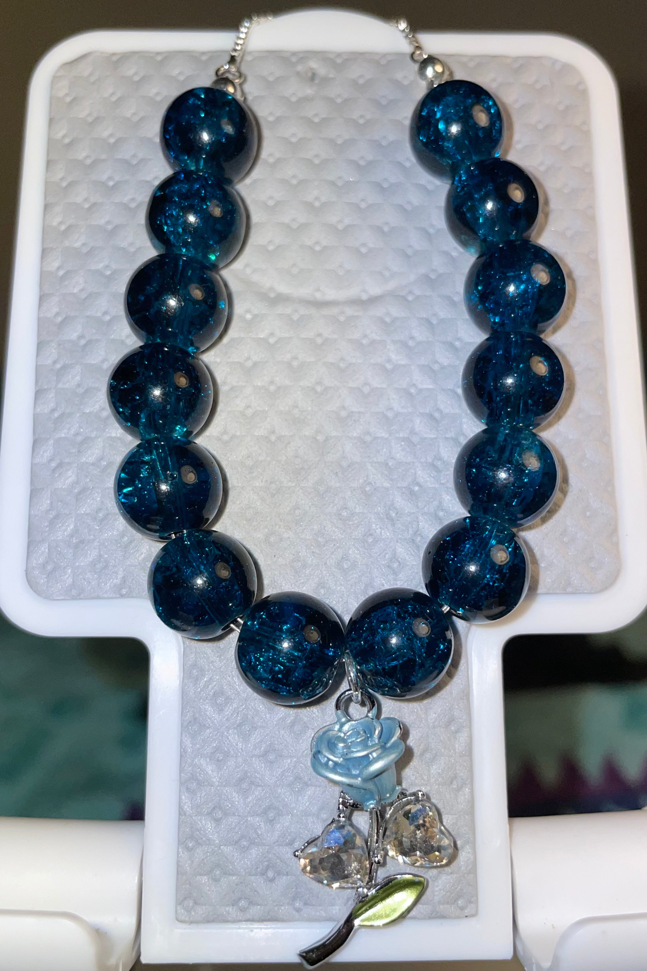 Dark blue beads with blue glass zirconia flower