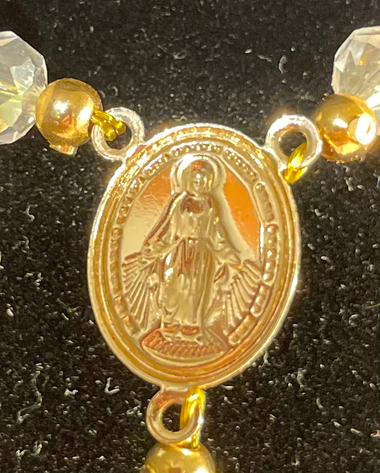 White beads/rosary with gold plated cross.