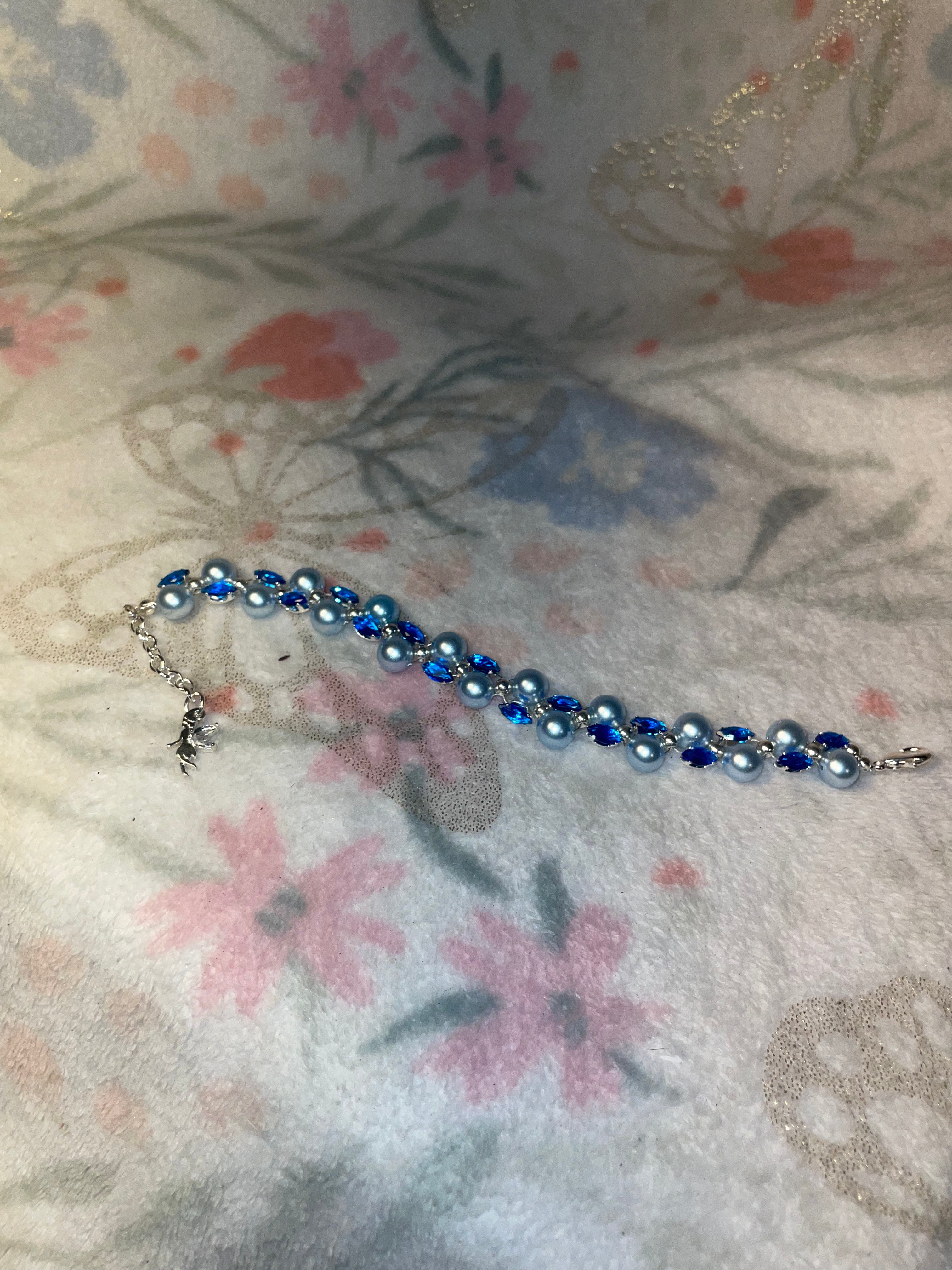 Blue bracelet with fairy