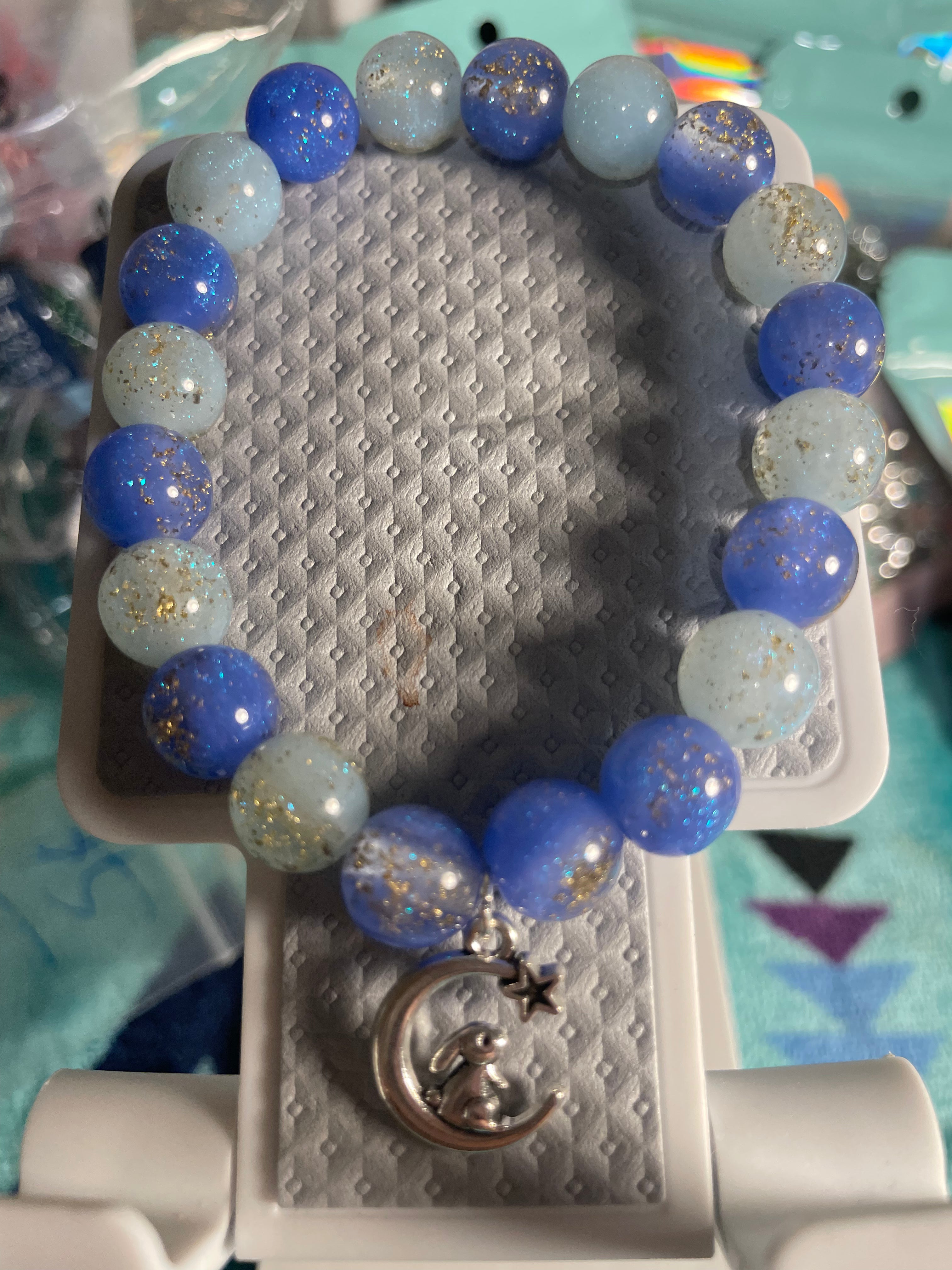 Light/dark blue bracelet with a cute bunny on the moon